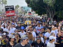 Thousands of people rally in front of Paramount Studios in support of the SAG-AFTRA and WGA strikes. 
