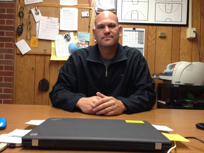 Craig Ferris in his office at Wyoming Indian Elementary School in Ethete, Wyo. Ferris spends most of his time driving around and knocking on doors on the vast Wind River Reservation.
