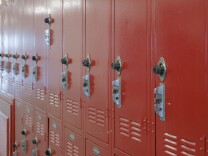 A row of red metal school lockers