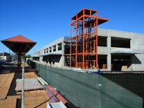 A parking garage being built at the new Monrovia station on the Gold Line Foothill Extension. Most of Metro's parking is currently free but a new proposal would impose a small charge for daily use.