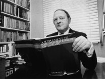 English writer and broadcaster Robert Robinson holding the first volume of 'A Supplement To The Oxford English Dictionary', 24th March 1977 — long before Wikipedia and Wiktionary put the practice of curating language and knowledge in the hands of the Internet-connected masses and before words like "selfie" and "cray" came to be formally added to dictionaries in just a few short years.