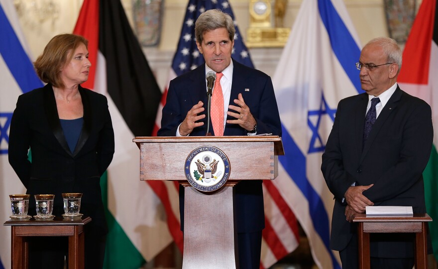WASHINGTON, DC - JULY 30:  U.S. Secretary of State John Kerry (C) makes a statement with Israeli Justice Minister Tzipi Livni (L) and Palestinian chief negotiator Saeb Erekat (R) during a press conference on the Middle East Peace Process Talks at the Department of State on July 30, 2013 in Washington, DC. Israeli Justice Minister Tzipi Livni and Palestinian chief negotiator Saeb Erekat joined Kerry in some of the first direct talks in three years between Israel and Palestine.  (Photo by Win McNamee/Getty Images)