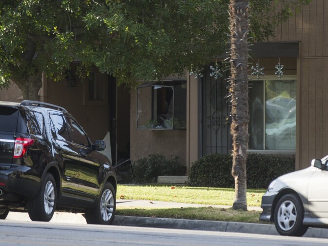 Authorities continue to search a home on the 50 block of N Center Street in Redlands on Thursday morning, Dec. 3, 2015 following Wednesday's mass shooting at in San Bernardino.