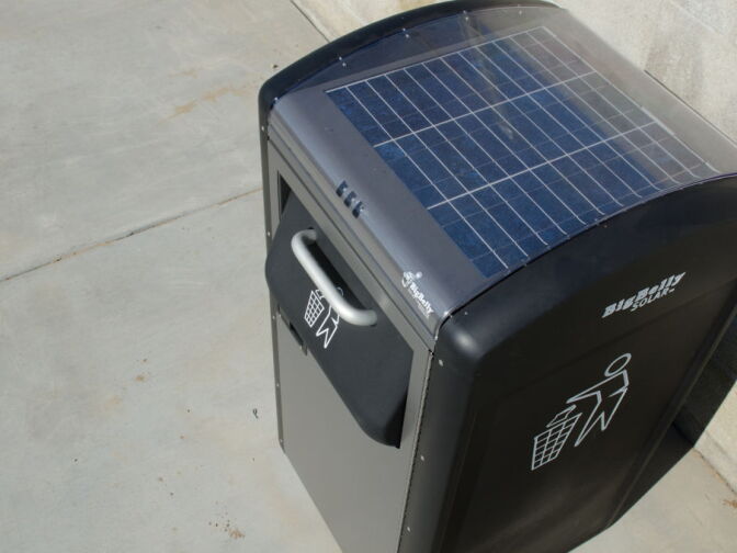 Solar powered compact trash cans are installed in the park.