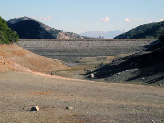 File: View of the nearly-empty Uvas Reservoir and the face of the dam on Feb. 1, 2014.