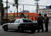 Officers from the Los Angeles County Sheriff's Department guard an intersection outside the Twin Towers Correctional Facility in downtown L.A. on Feb. 8, 2013, following reports that murder suspect Christopher Dorner was seen in the area. The correctional facility and adjoining L.A. County Men's Central Jail were on high alert after the report, resulting in area traffic checkpoints conducted by officers in ballistic vests and helmets.