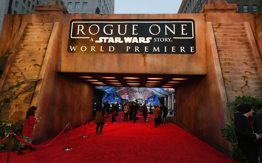 HOLLYWOOD, CA - DECEMBER 10:  People walk near an entrance to the red carpet before the premiere of Walt Disney Pictures and Lucasfilm's "Rogue One: A Star Wars Story" at the Pantages Theatre on December 10, 2016 in Hollywood, California.  (Photo by Ethan Miller/Getty Images)
