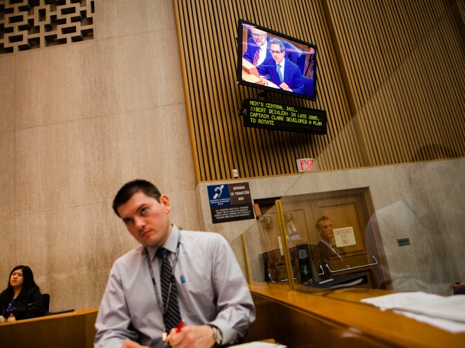 Attorney Bert Deixler is seen on a monitor as he questions Undersheriff Paul Tanaka about allegations of abuse in LA County jails.
