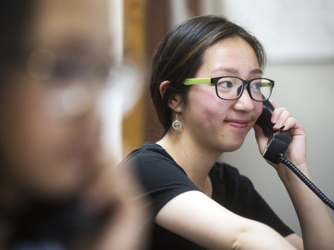 Yvonne Cui, a senior at San Gabriel High School, makes a call in Mandarin during a phone bank shift reminding people to vote at the Asian Americans Advancing Justice Los Angeles on Monday evening, May 23, 2016. Monday was the final day to register to vote in Los Angeles County before the primary election in June.