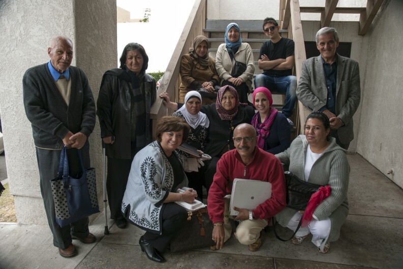 Iraqi war refugees gather with Access California Services staff outside their offices in Anaheim, Calif. on March 7. Access California Services aims to address the needs of Anaheim's Arab-American population, much of which consists of refugees from the war in Iraq.