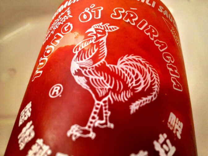 Close up of a Sriracha chili sauce bottle. 
