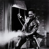 Black and white image of man firing pistol