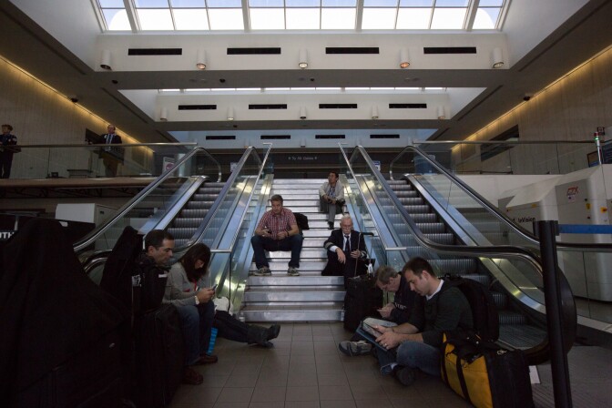 Passengers wait for their flights after a shooting at LAX on November 1st, 2013.
