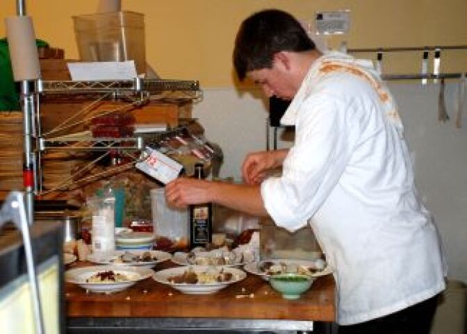 Saul Sutcher's preps for gourmet Cafe Norris meal.