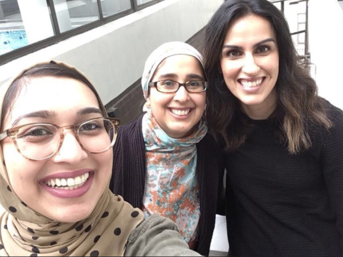 Sahar Pirzada of HEART Women & Girls takes a selfie with fellow staffers. 