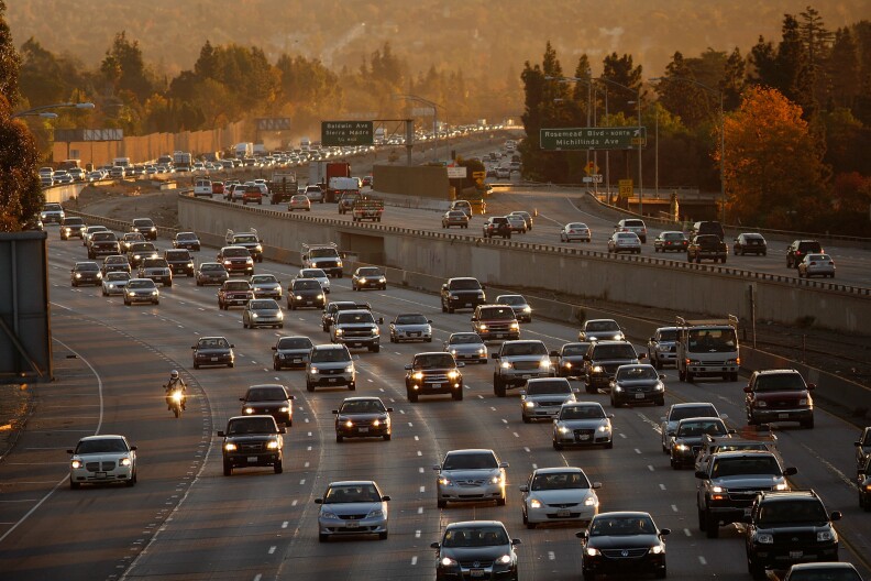 PASADENA, CA - DECEMBER 1:  Morning commuters travel the 210 freeway between Los Angeles and cities to the east on December 1, 2009 near Pasadena, California. President Barack Obama will attend the international climate negotiations in Copenhagen next week with a vow to reduce US greenhouse gas emissions to about 17 percent below 2005 levels by 2020, and 83 percent by 2050. Meanwhile, California, which has some of the toughest clean air laws after decades of fighting some of the worst smog in the nation, is in the final phase of building a cap-and-trade market to provide incentives to reduce greenhouse emissions.  More than 60 world leaders are expected to take part in the climate negotiations in Copenhagen.   (Photo by David McNew/Getty Images)
