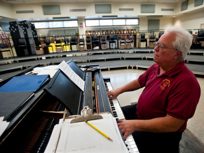 Vocal music teacher Tony Azeltine plays piano in one of the new music classrooms at Mark Keppel High School.