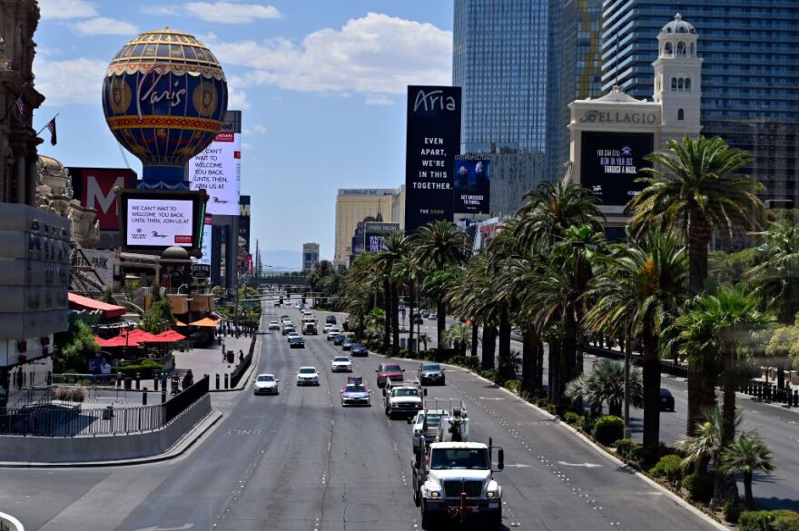 LAS VEGAS, NEVADA - JUNE 04: Vehicle traffic moves along the Las Vegas Strip as casinos are beginning to open for the first time since being closed on March 17 because of the coronavirus (COVID-19) pandemic, on June 4, 2020 in Las Vegas, Nevada. Hotel-casinos throughout the state are opening today as part of a phased reopening of the economy with social distancing guidelines and other restrictions in place. (Photo by David Becker/Getty Images)