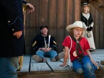 Performers from the Band of the California Battalion prepare for a parade down Main Street on Sunday during the 20th annual Santa Clarita Cowboy Festival at the Melody Ranch Motion Picture Studio, where Oscar-winning film Django Unchained was filmed.