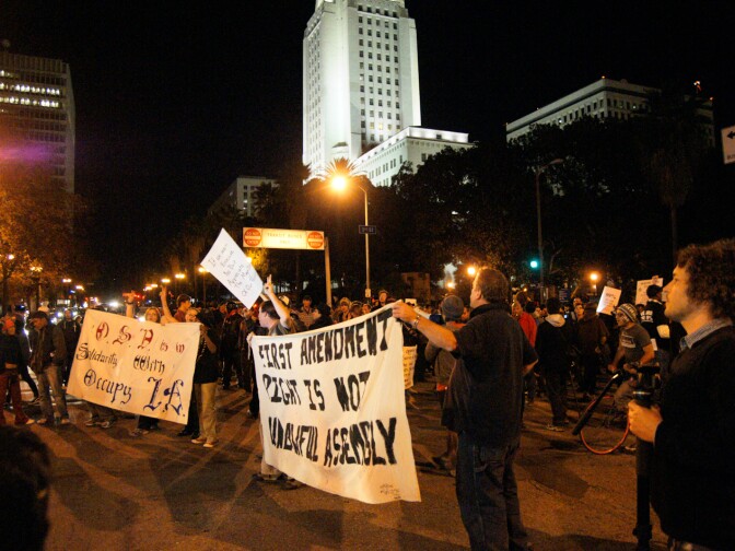 Midnight—Crowds stay strong outside City Hall as the deadline arrives for the building's south lawn to be closed.