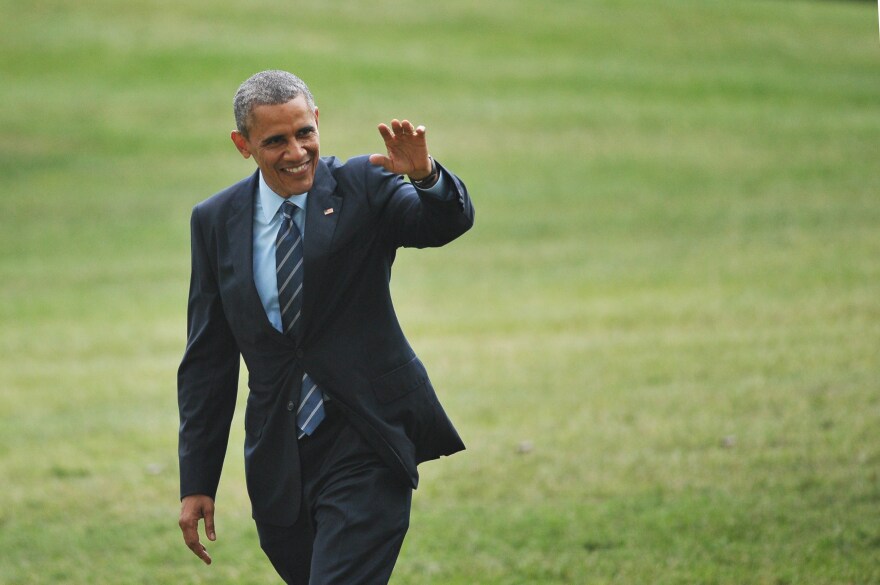 US President Barack Obama makes his way across the South Lawn upon return to the White House on July 10, 2014 in Washington, DC. Obama returned to Washington after visiting Colorado and Texas. 