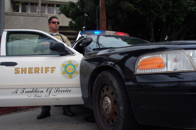 Sheriff's Deputy Rodriguez, an officer from the Los Angeles County Sheriff's Department, guards an intersection outside the Twin Towers Correctional Facility in Los Angeles on Feb. 8, 2013, following reports that murder suspect Christopher Dorner was seen in the area. The correctional facility and adjoining L.A. County Men's Central Jail were on high alert after the report, resulting in area traffic checkpoints conducted by officers in ballistic vests and helmets.