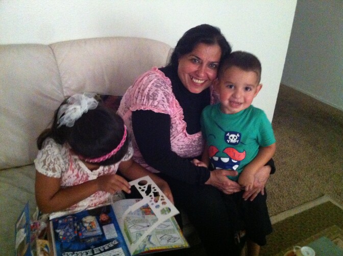 Maladh Mohammed Ali with her niece's son at their apartment in El Cajon. Maladh's son was killed while working as an interpreter for U.S. troops in Iraq.
