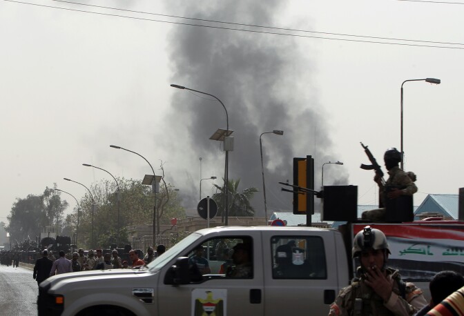Iraqi officials said Monday that five car bombs struck in predominantly Shiite cities and districts in central and southern Iraq, killing 36 people and wounding dozens in the latest wave of violence roiling the country.(Photo: Smoke billows from the scene of a bomb attack in Baghdad, on March 14, 2013). 