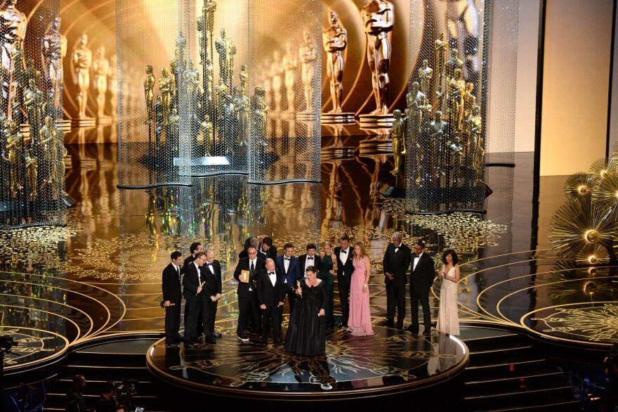 HOLLYWOOD, CA - FEBRUARY 28: Cast and crew of 'Spotlight,' including actors Brian d'Arcy James, Michael Keaton, writer-director Tom McCarthy, actor Mark Ruffalo, producers Nicole Rocklin and Blye Pagon Faust, screenwriter Josh Singer, producer Michael Sugar, actors Rachel McAdams and Liev Schreiber, and producer Steve Golin accept the Best Picture award onstage during the 88th Annual Academy Awards at the Dolby Theatre on February 28, 2016 in Hollywood, California. (Photo by Kevin Winter/Getty Images)