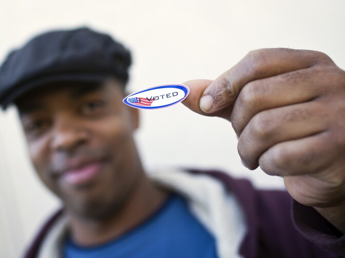 Al Gordon puts on his "I Voted" sticker after voting in the Los Angeles County primary election on Tuesday, March 3, 2015 at Saint Mary of the Angels in Los Feliz.