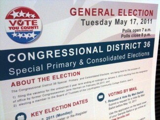 A placard at the debate with information about the special 36th Congressional District election