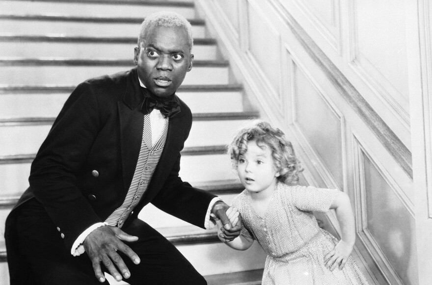 Bill "Bojangles" Robinson and Shirley Temple perform their famous stair dance in the 1935 film <em>The Little Colonel.</em>