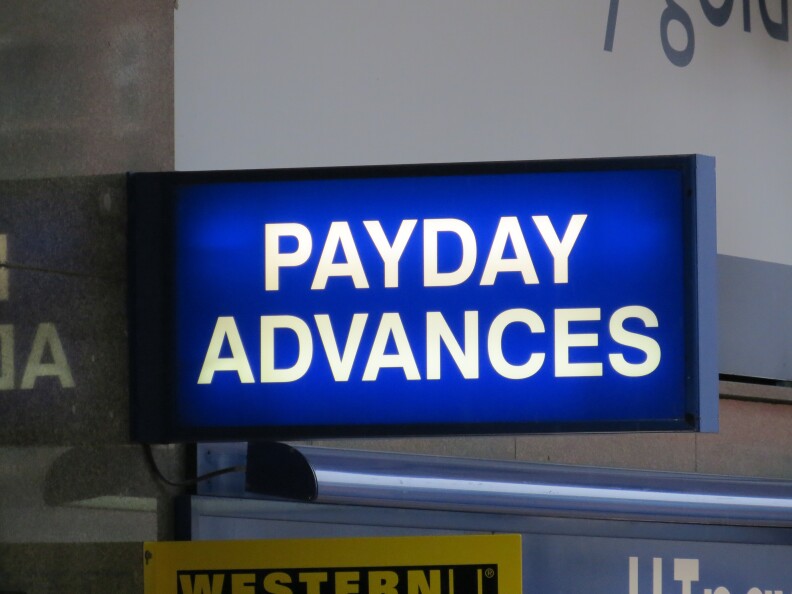 Payday loan business sign .