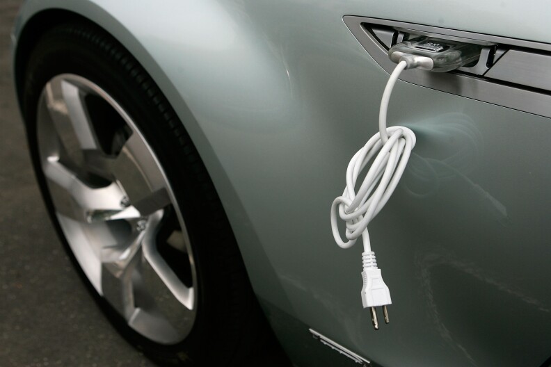 WASHINGTON - JULY 19:  An electric cable is attached to the side of a Chevrolet Volt vehicle during a viewing on Capitol Hill July 19, 2007 in Washington, DC. The Volt is a plug-in electric vehicle which will run its first 40 miles without using any gasoline, and then the battery pack will be re-charged by a small internal combustion engine that runs on gas, diesel or ethanol when required. The vehicle is expected to be on the market by 2010.  (Photo by Alex Wong/Getty Images) 