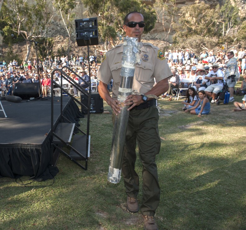 Kevin Estrada with Orange County Parks carries the1966 time capsule during its unveiling on Monday night at Dana Point Harbor. 

///ADDITIONAL INFO: DP.Timecapsule.0830-083916 -ANA VENEGAS, ORANGE COUNTY REGISTER

Fifty years ago today a time capsule was buried near the breakwater and jetty of the Dana Point Harbor. The time capsule contents will be unveiled at Baby Beach. The event also includes folks who were there when the time capsule was buried.