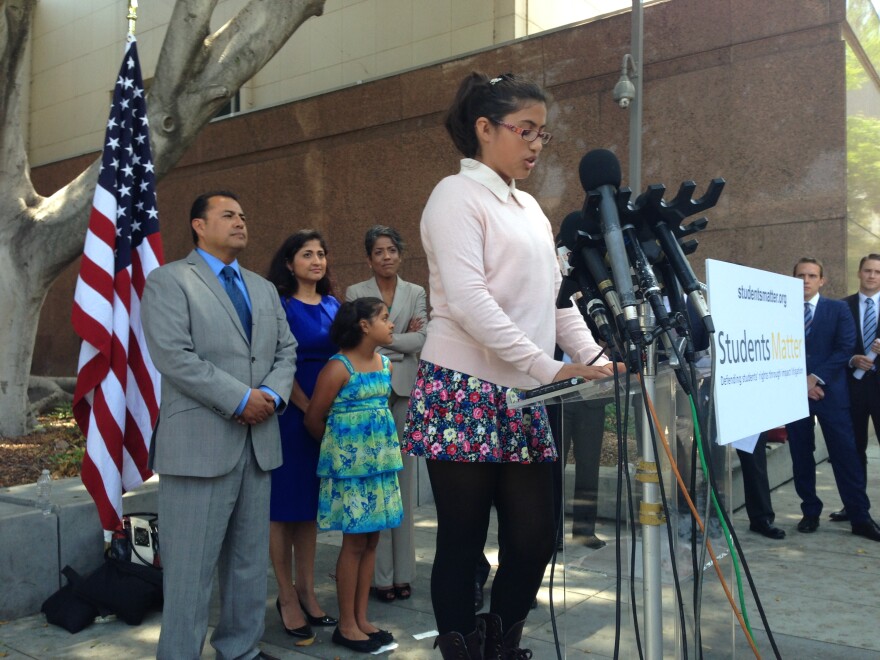 In this file photo, Julia Macias, one of nine plaintiffs in the Vergara v. California trial, welcomes a judge's ruling in June striking down teacher job protections.