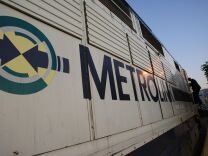 A conductor steps down from the engine of a Metrolink train on a Los Angeles-boun freight train on Sept. 15, 2008 in Chatsworth, California.