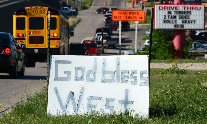 A makeshift sign is placed on the side of a road in West, Texas, on April 20, 2013, three days after the April 17 fertilizer plant blast which killed and injured residents of this small Texas community.