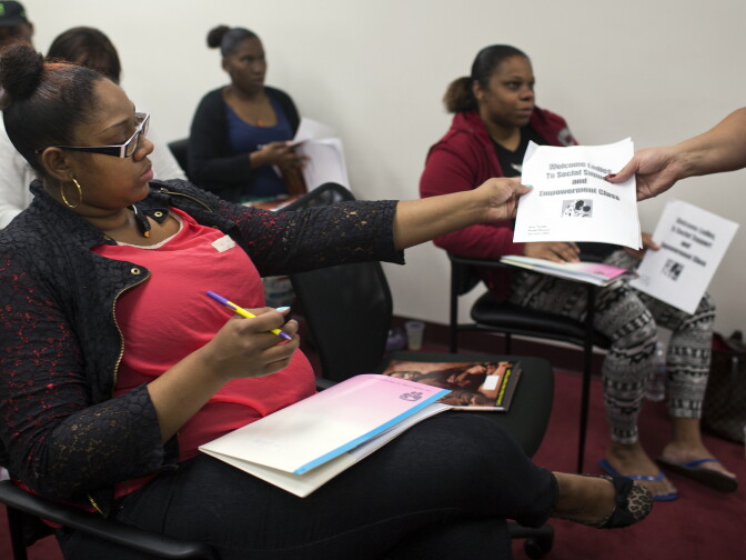 Expecting mothers fill out a form on the first day of a four-day class put on by Great Beginnings for Black Babies.