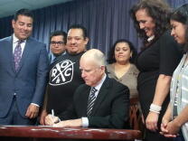 Gov. Jerry Brown signed a bill Wednesday in Los Angeles mandating the paid leave that supporters say will guarantee workers don't lose jobs or salaries if they get sick.