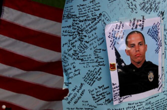 Memorial for slain officer Ryan Bonaminio near the site of his murder in Riverside’s Fairmount Park