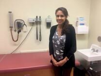 Claudia Martin, a physician for the L.A. Unified School District, poses for a portrait in an examination room at the district's Student Enrollment Placement and Assessment Center. Many immigrant families and children — including some newcomers who arrived without parents — are referred here for medical, psychological and social worker services.