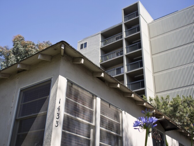 A one-story home sits next to a nine-story senior housing building on 21st Street in Santa Monica. Mario Fonda-Bonardi, an architect and Santa Monica resident, says the apartment building casts shadows over the adjacent home.
