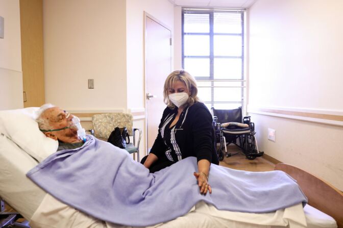 LOS ANGELES, CALIFORNIA - MARCH 24: Resident Hanna Nasi is visited by daughter Surab Nasrallah on the first day of in-room family member visits at the Ararat Nursing Facility in the Mission Hills neighborhood on March 24, 2021 in Los Angeles, California. 80 percent of residents were vaccinated and in-room family member visits are once again permitted at the skilled nursing facility amid eased COVID-19 restrictions. (Photo by Mario Tama/Getty Images)