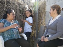 Rocio Alfaro (left), Wendy Mendez (middle) and Mery Alvarez (right) attend a lunch on Feb. 10, 2016 in Watts where the topic of conversation was the upcoming 2016 elections.