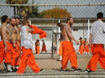 File photo: Inmates exercise at Chino State Prison in 2010.