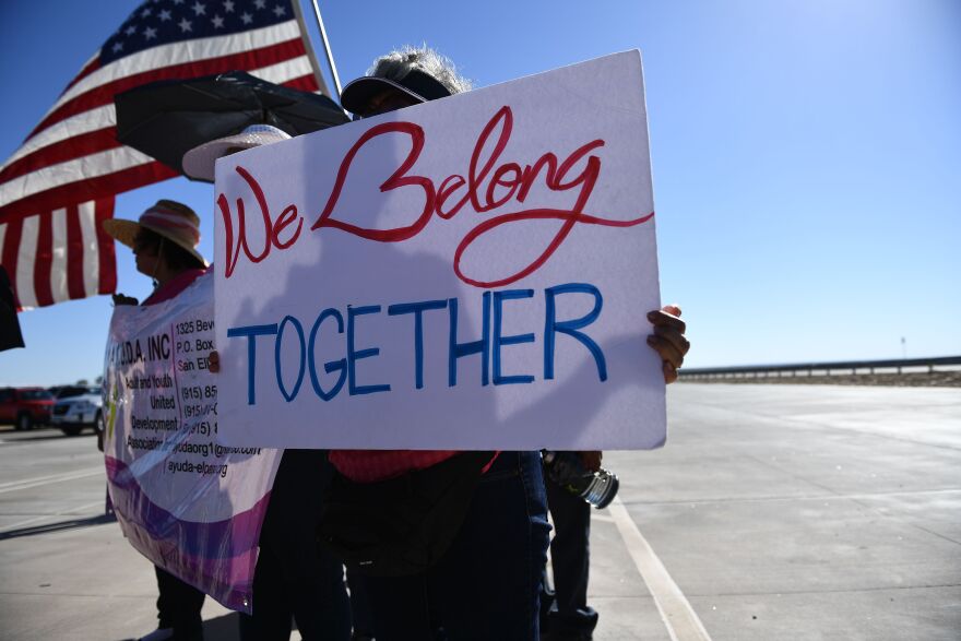 People display signs at the Tornillo Port of Entry near El Paso, Texas, June 21, 2018 during a protest rally including several American mayors against the US administration's family separation policy. - President Donald Trump ordered an end to the separation of migrant children from their parents on the US border June 20, 2018, reversing a tough policy under heavy pressure from his fellow Republicans, Democrats and the international community. The spectacular about-face comes after more than 2,300 children were stripped from their parents and adult relatives after illegally crossing the border since May 5 and placed in tent camps and other facilities, with no way to contact their relatives. (Photo by Brendan Smialowski / AFP)        (Photo credit should read BRENDAN SMIALOWSKI/AFP/Getty Images)