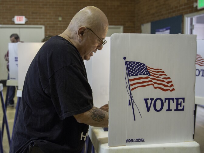 Edmund Lara casts his ballot at a polling center in Boyle Heights on Tuesday, June 5, 2018.