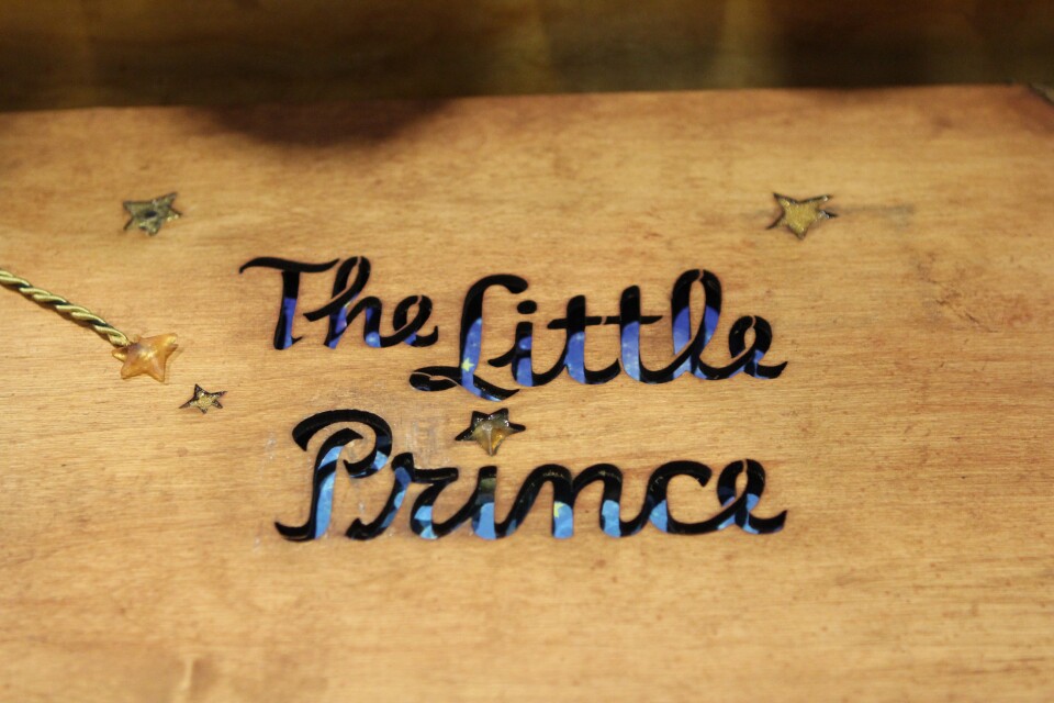 Wooden cover of a book of concept art for "The Little Prince"