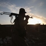 A Kurdish Peshmerga soldier mans an observation post on the frontline with ISIS November 5, 2015 near Telskuf in northern Iraq. 